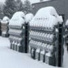 Commercial electric meter farm under winter weather conditions, showcasing low-temperature resilience and weatherized utility infrastructure.